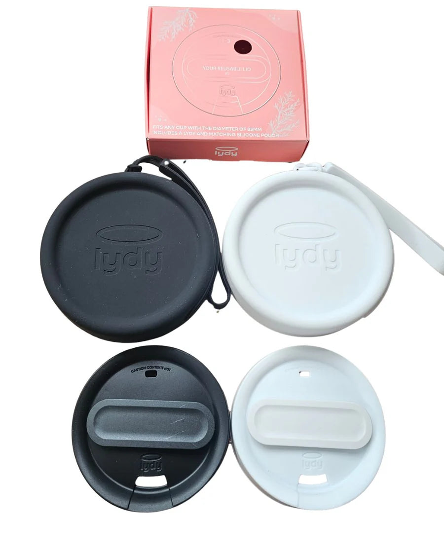 Product shot of two Lydy reusable silicone coffee cup lids and their matching pouch cases in black and white, with the pink packaging box above.