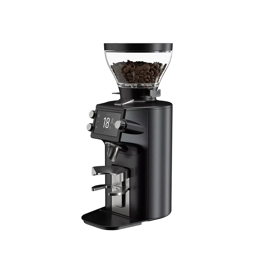 An angled view of a Mahlkonig E64 WS espresso grinder in black, featuring a clear bean hopper, digital screen displaying 18.0g, and portafilter fork.