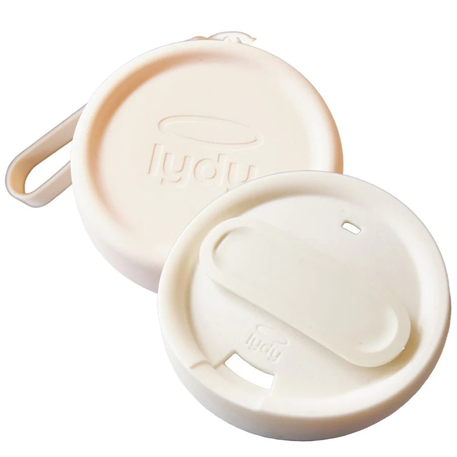 Angled view of a Lydy Milk reusable silicone coffee cup lid with its matching carrying pouch on a white background.